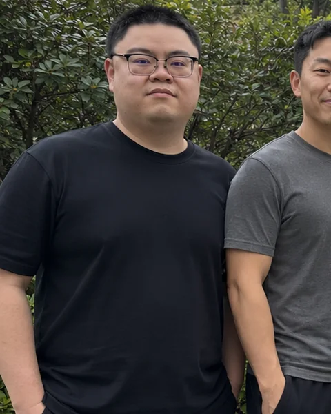 Andy standing outdoors in a black T-shirt before beginning coaching with Zeke